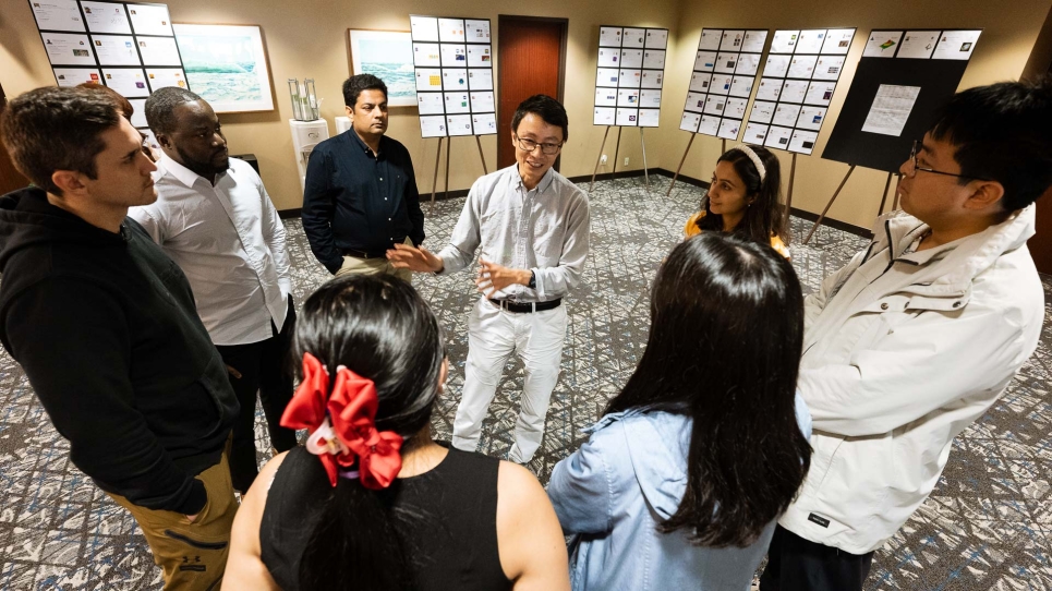Participants gather for a discussion at ATPESC 2025